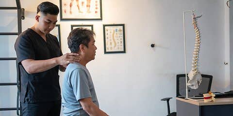 Chiropractor working on patient's neck