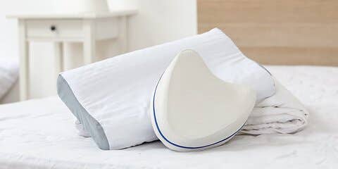 Two pillows on bed